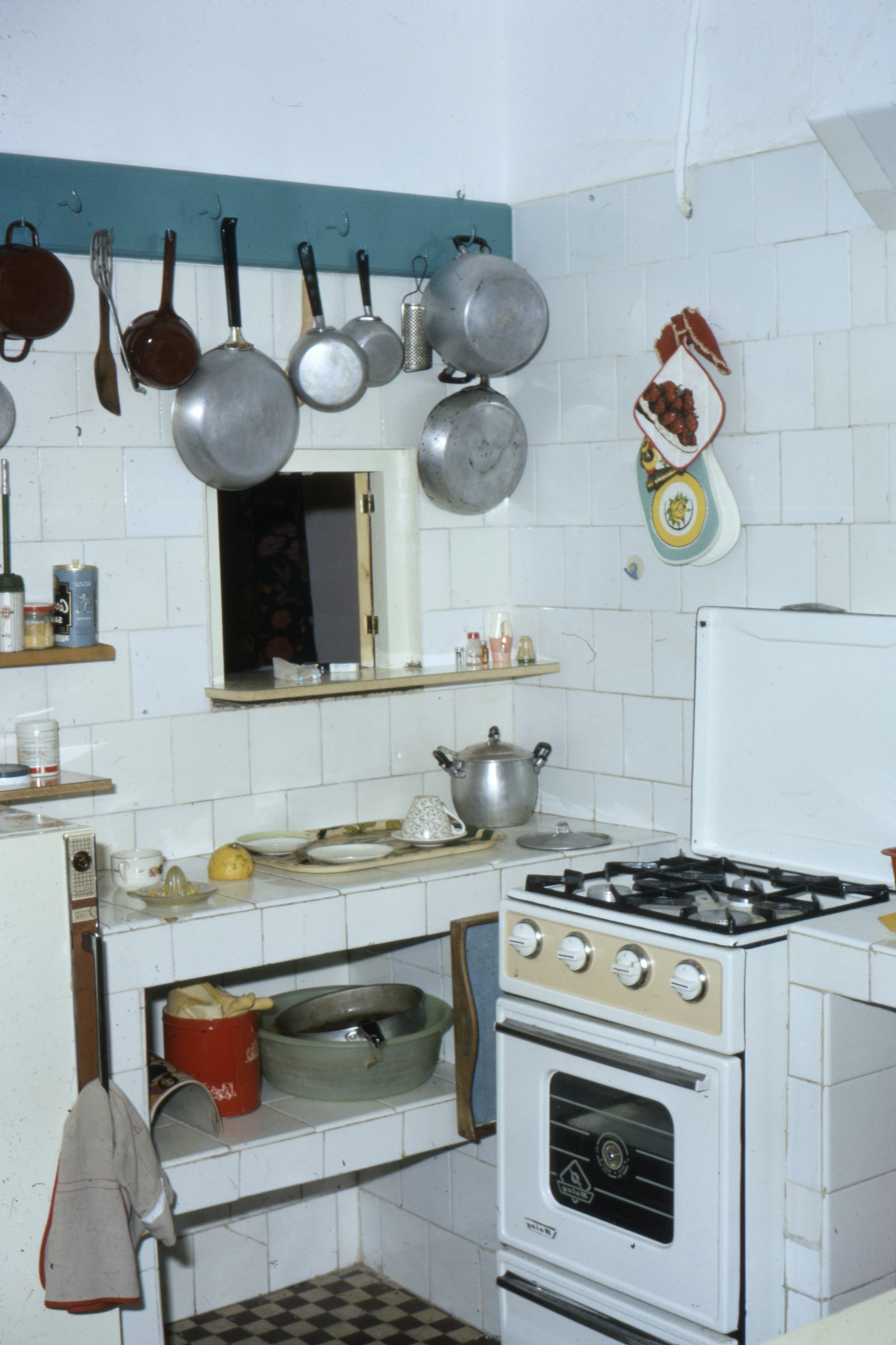 Kitchen before — dated cabinets and layout
