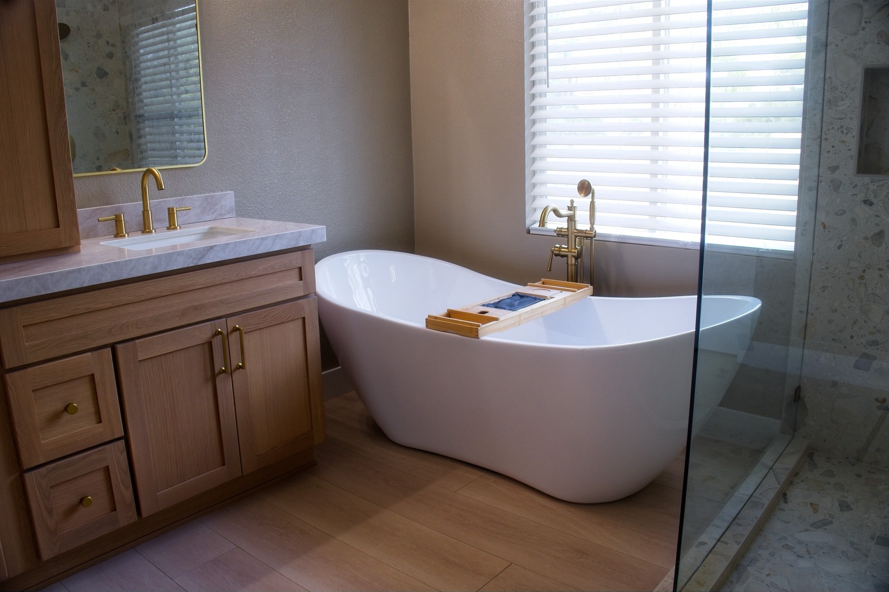 Freestanding soaking tub and glass shower